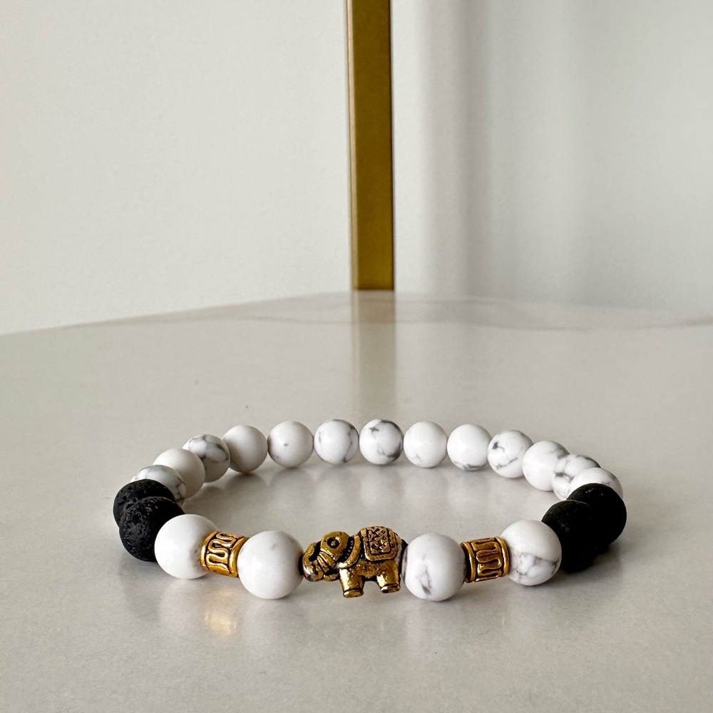 Howlite and Black Lava Beaded Bracelet with Gold Elephant Charm